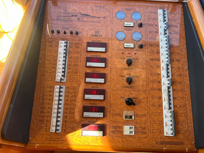  Yacht Photos Pics Control panel of a 2002 Ferretti Yachts 810, featuring switches and digital displays.