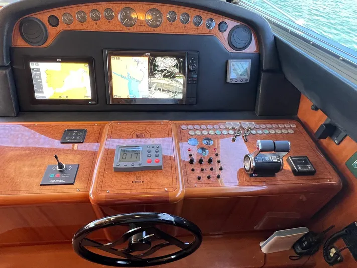  Yacht Photos Pics Helm of 2002 Ferretti Yachts 810 with navigation screens and controls.