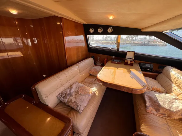  Yacht Photos Pics Luxurious interior of 2002 Ferretti Yachts 810 with plush seating and elegant wood finishes.