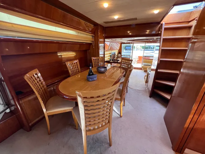  Yacht Photos Pics Luxurious interior of 2002 Ferretti Yachts 810 with elegant dining area and wooden finishes.