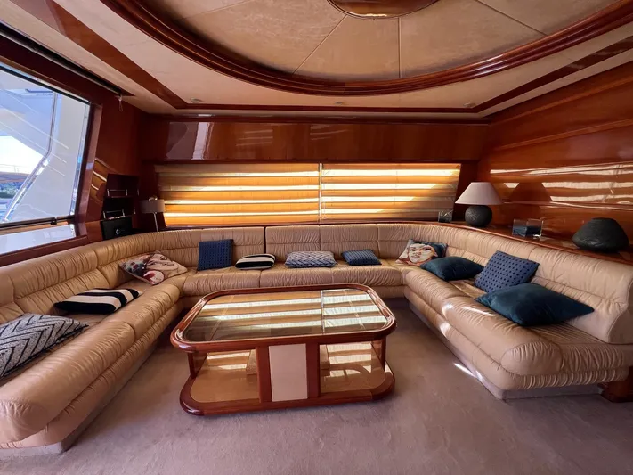  Yacht Photos Pics Luxurious interior of a 2002 Ferretti Yachts 810 with plush seating and elegant decor.
