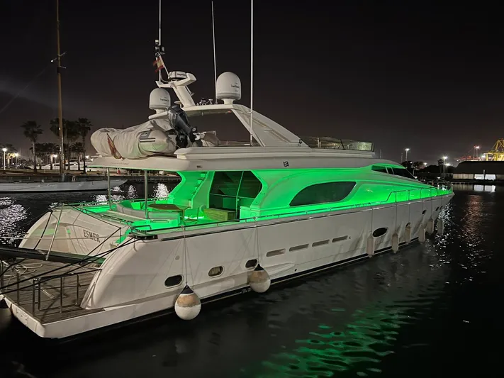  Yacht Photos Pics 2002 Ferretti Yachts 810 illuminated with green lights, docked at night.