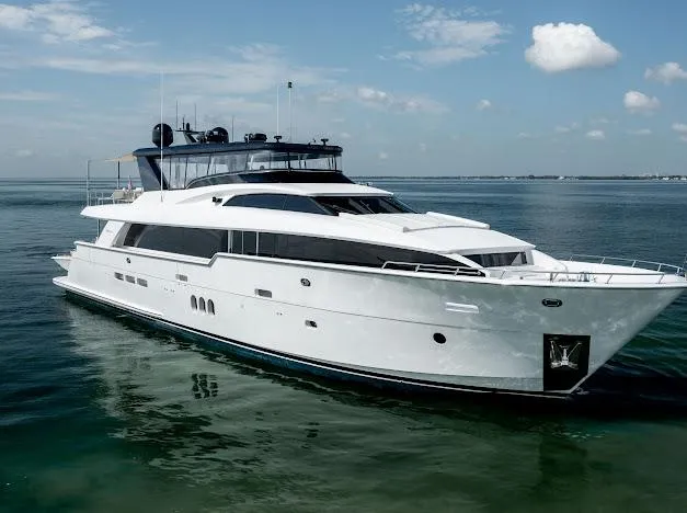 Living The Experience Yacht Photos Pics 2015 Hatteras 100 Raised Pilothouse yacht cruising on calm waters.