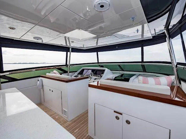 Living The Experience Yacht Photos Pics 2015 Hatteras 100 Raised Pilothouse yacht interior with modern helm and panoramic windows.