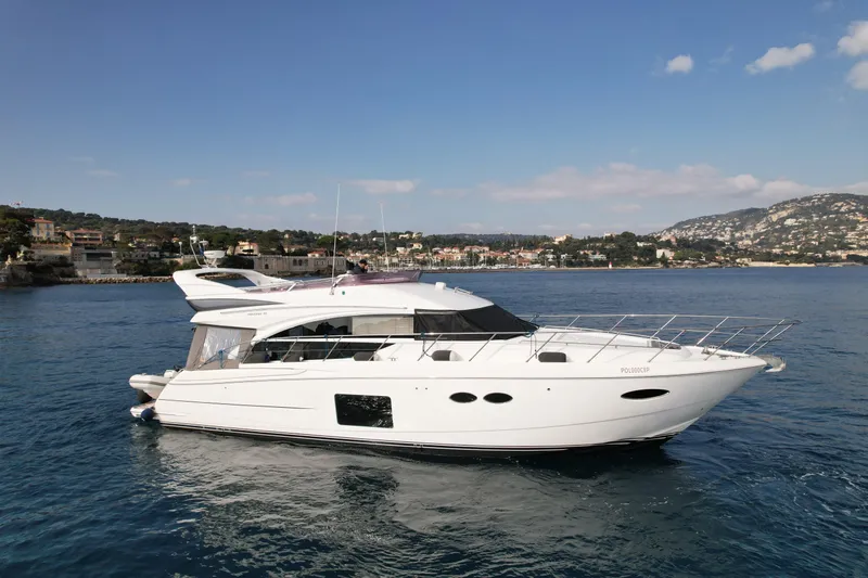  Yacht Photos Pics Luxury 2016 Princess 56 yacht cruising on calm blue waters.