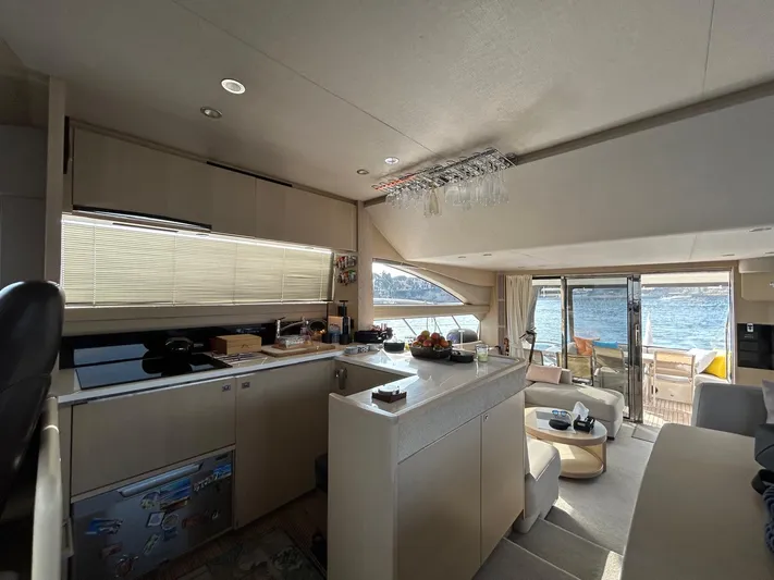  Yacht Photos Pics Luxurious interior of a 2016 Princess 56 yacht with modern kitchen and ocean view.