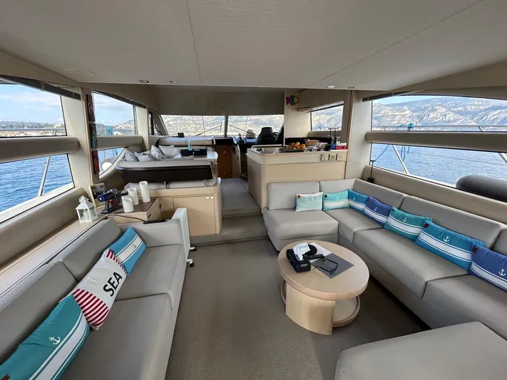  Yacht Photos Pics Luxurious interior of a 2016 Princess 56 yacht with comfortable seating and scenic views.