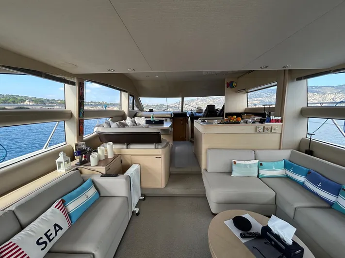 Yacht Photos Pics Luxurious interior of a 2016 Princess 56 yacht with scenic ocean views.