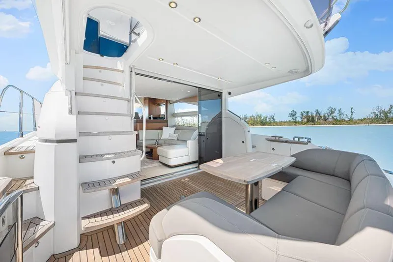  Yacht Photos Pics Luxurious 2017 Princess 56 yacht interior with elegant seating and scenic ocean view.