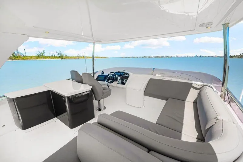  Yacht Photos Pics Luxurious 2017 Princess 56 yacht interior with modern seating and scenic ocean view.