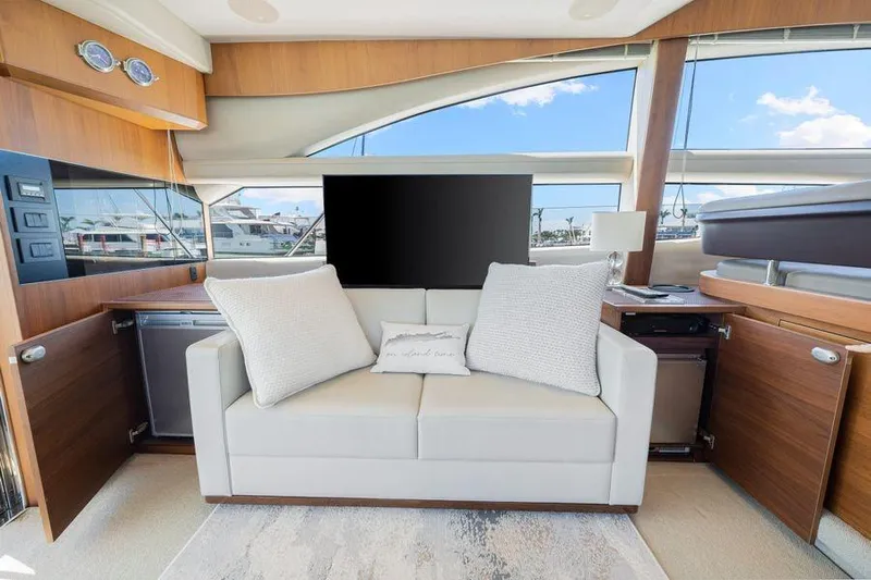  Yacht Photos Pics Luxurious interior of 2017 Princess 56 yacht with modern sofa and large windows.