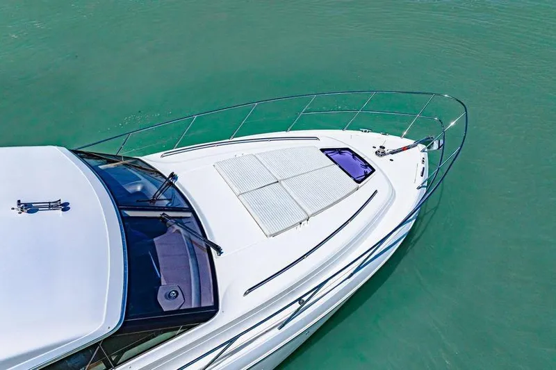  Yacht Photos Pics Aerial view of 2017 Princess 56 yacht on turquoise water.