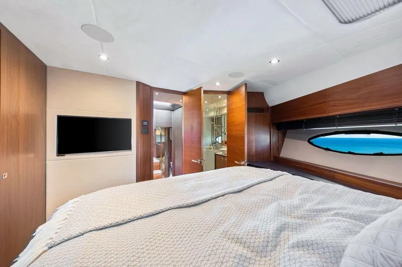  Yacht Photos Pics Luxurious bedroom interior of 2017 Princess 56 yacht with ocean view.
