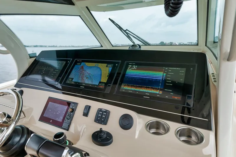Pain Killer Yacht Photos Pics 2018 Scout 380LXF boat dashboard with advanced navigation and control systems.