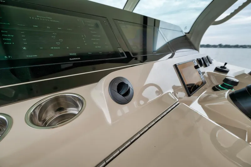 Pain Killer Yacht Photos Pics Control panel of 2018 Scout 380LXF boat with modern navigation displays.