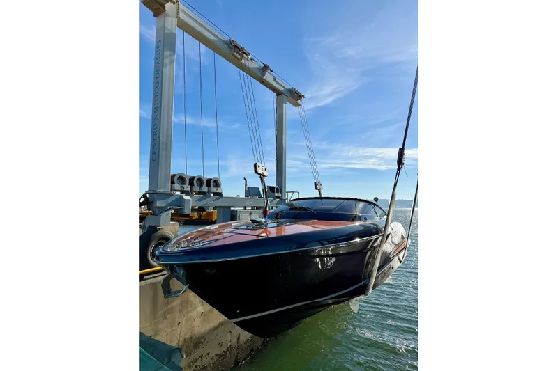  Yacht Photos Pics 2025 Riva Rivamare yacht suspended at Centro N&aacute;utico de Alg&eacute;s, under clear blue sky.