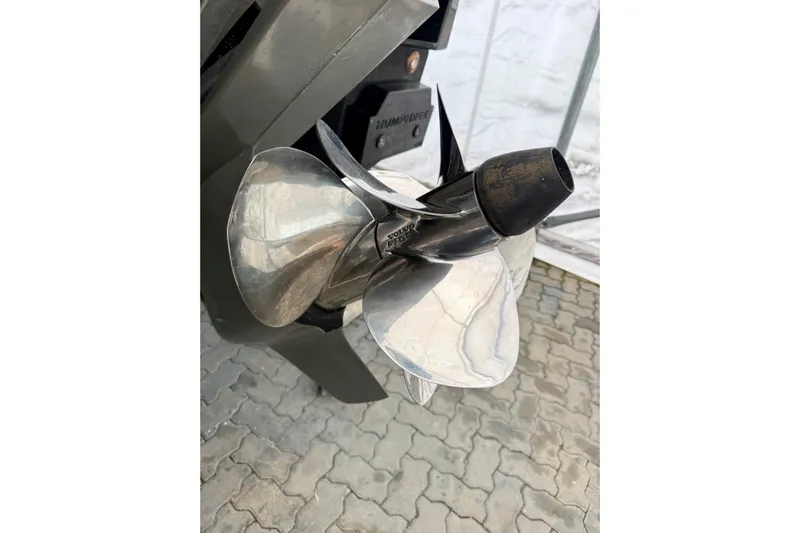  Yacht Photos Pics Close-up of a 2025 Riva Rivamare boat propeller on a paved surface.