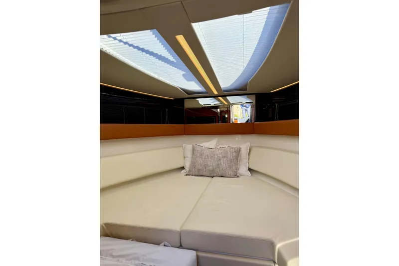  Yacht Photos Pics Luxurious interior of 2025 Riva Rivamare yacht with elegant seating and skylight.