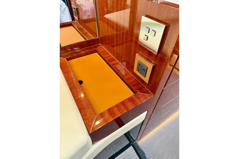  Yacht Photos Pics Luxurious 2025 Riva Rivamare yacht interior with elegant wood finish and modern controls.