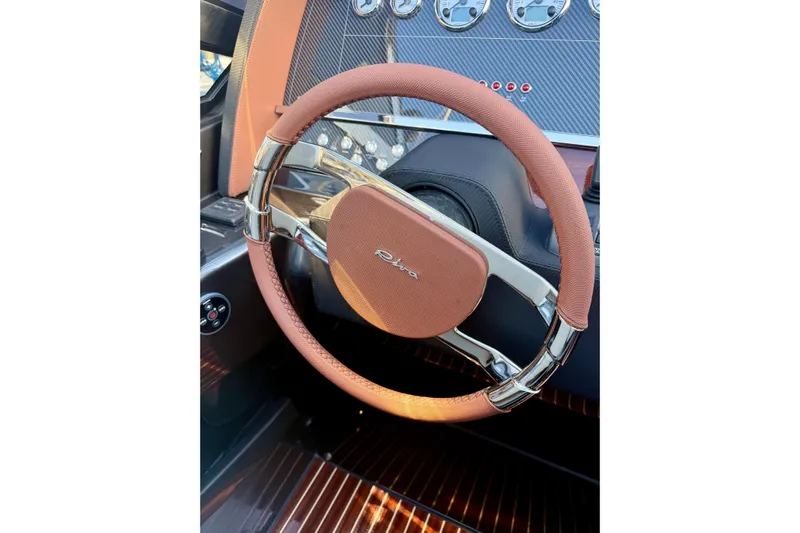  Yacht Photos Pics 2025 Riva Rivamare steering wheel with elegant design and luxury dashboard.