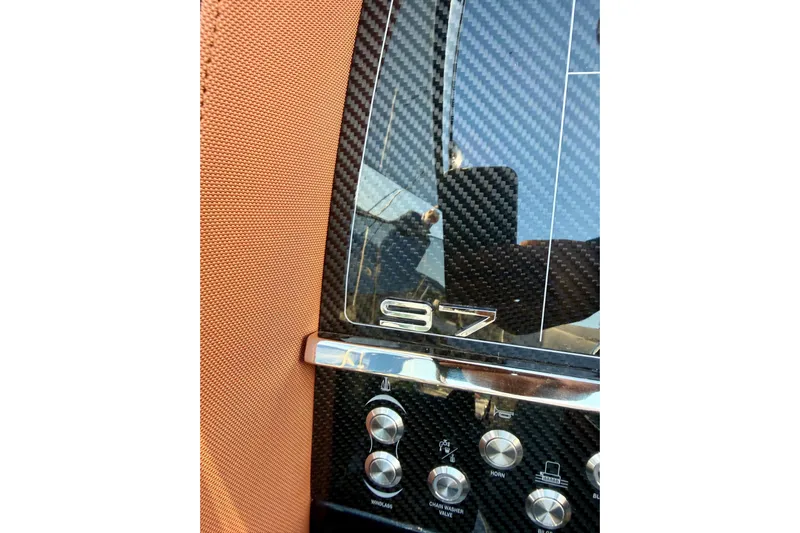  Yacht Photos Pics 2025 Riva Rivamare dashboard with carbon fiber finish and control buttons.