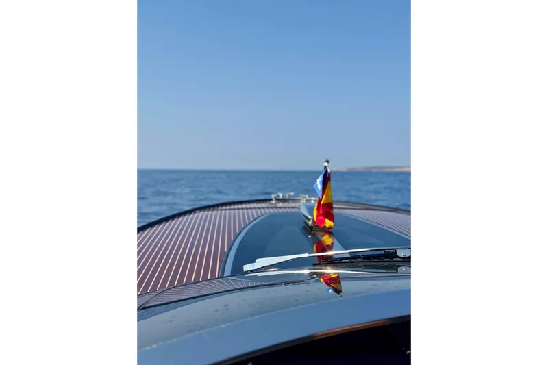  Yacht Photos Pics 2025 Riva Rivamare yacht cruising on open sea under clear blue sky.