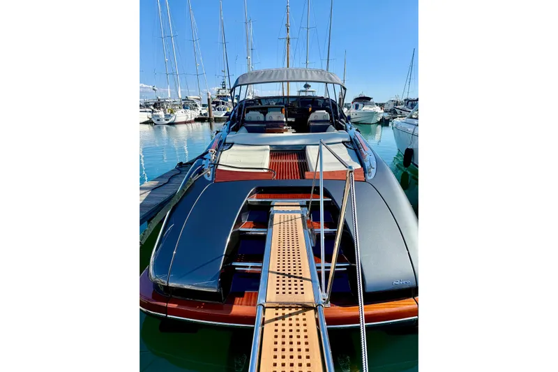  Yacht Photos Pics 2025 Riva Rivamare luxury yacht docked at marina, showcasing sleek design and elegance.