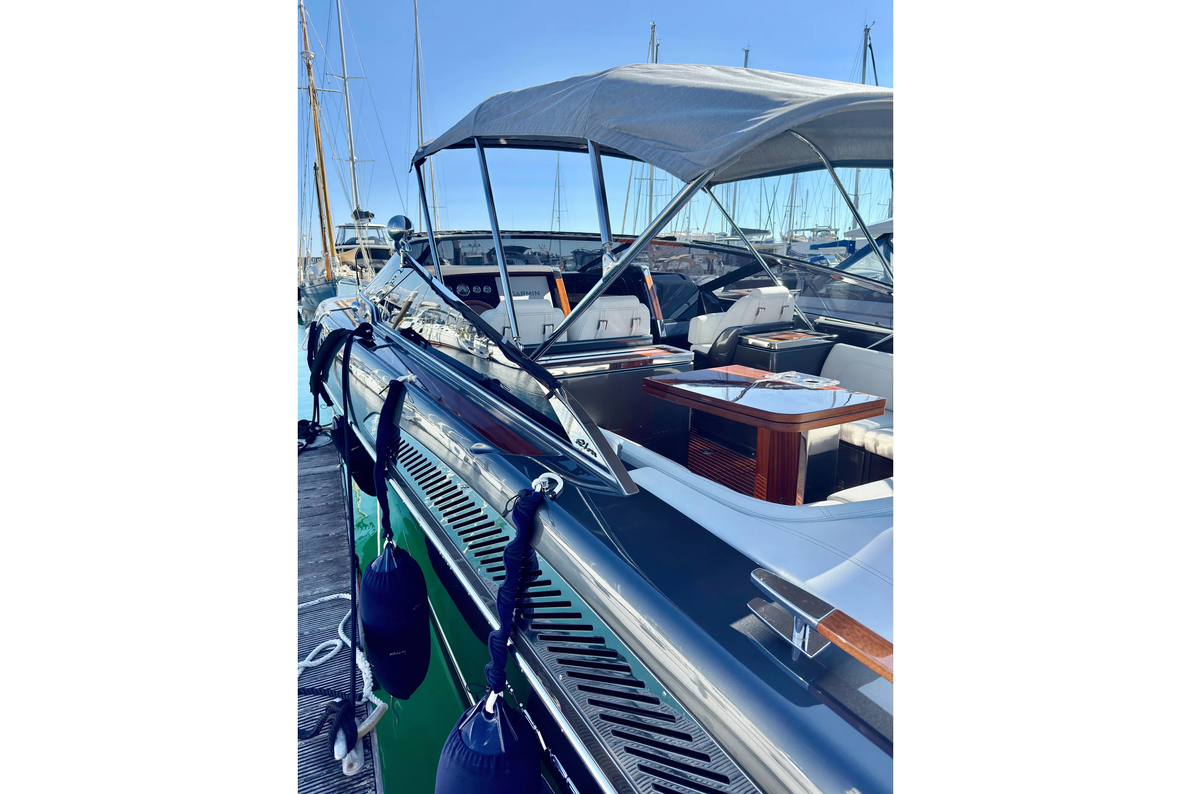  Yacht Photos Pics 2025 Riva Rivamare luxury yacht docked, featuring sleek design and elegant interior.