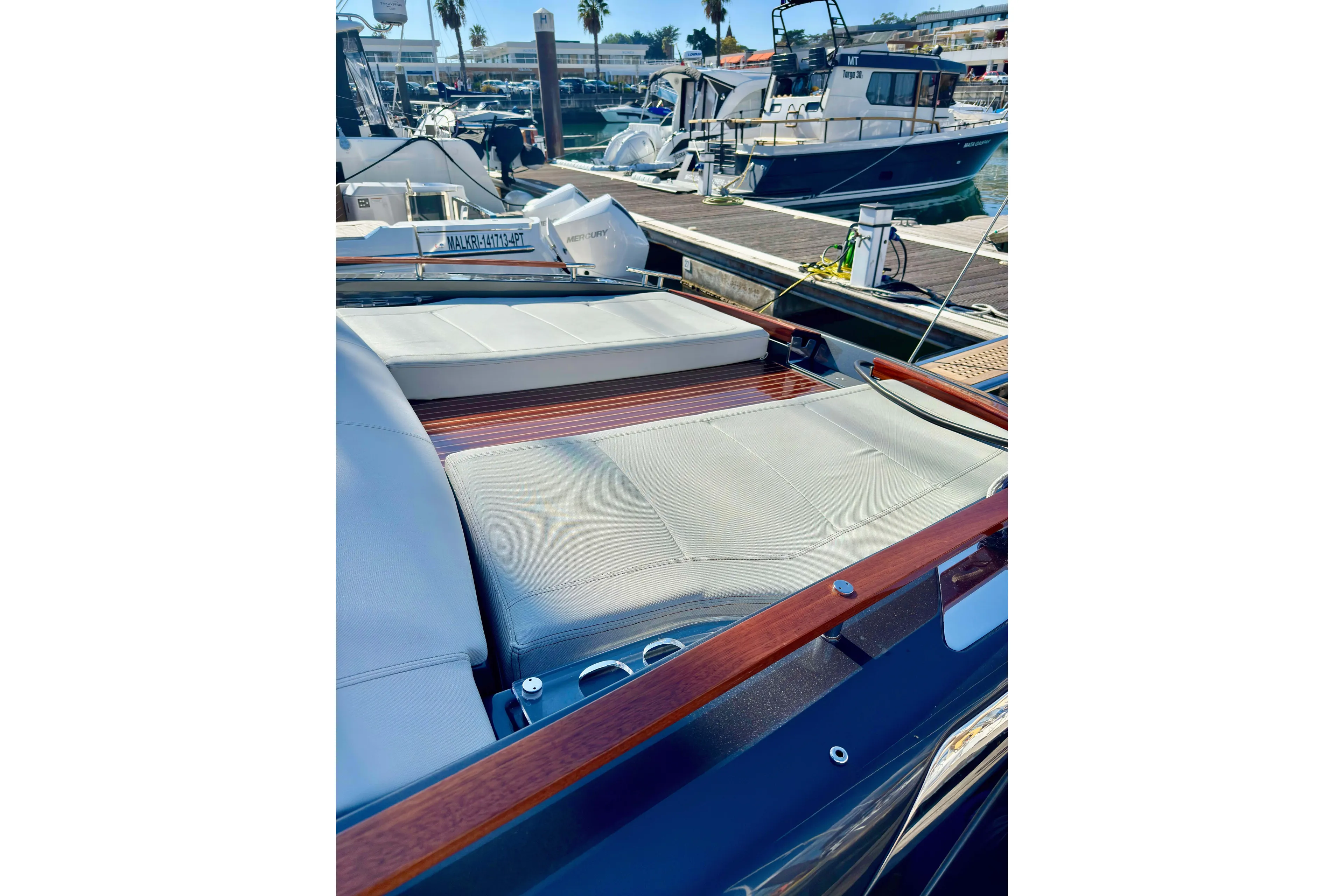  Yacht Photos Pics 2025 Riva Rivamare luxury yacht with sleek design and comfortable seating at marina.