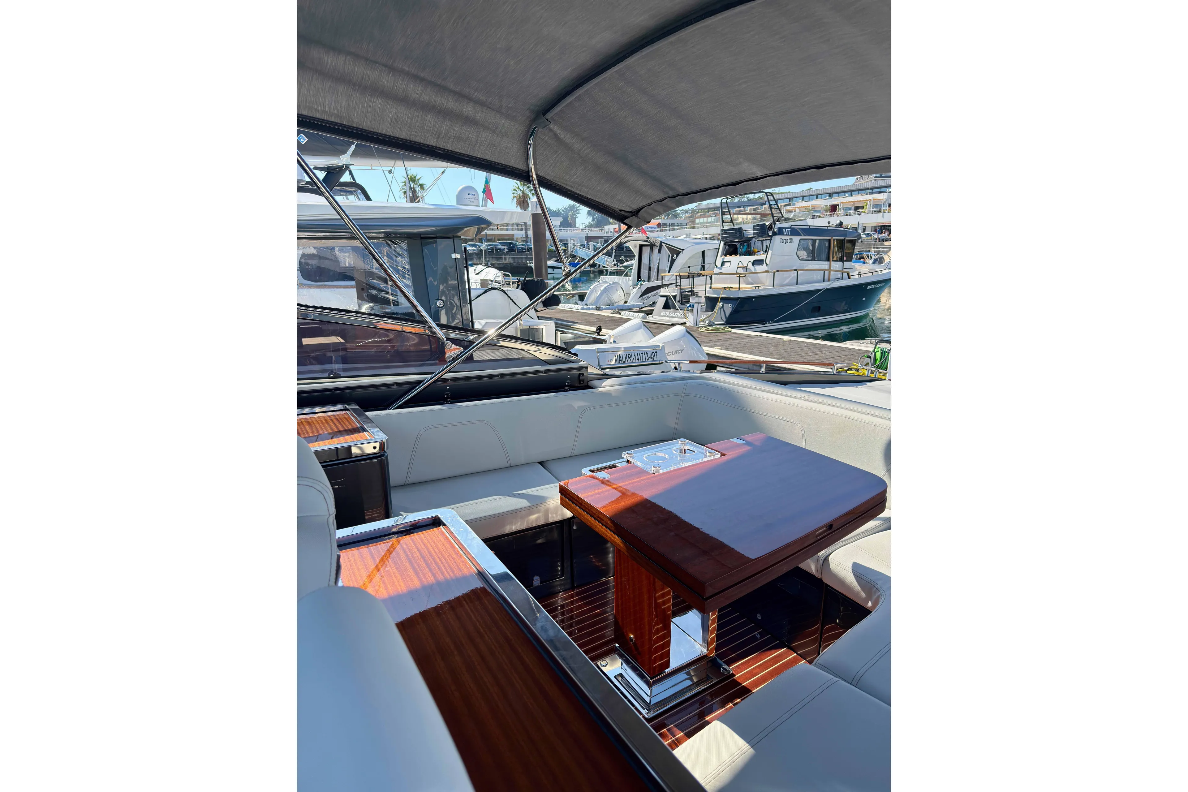  Yacht Photos Pics Luxurious 2025 Riva Rivamare yacht interior with elegant seating and polished wood table.