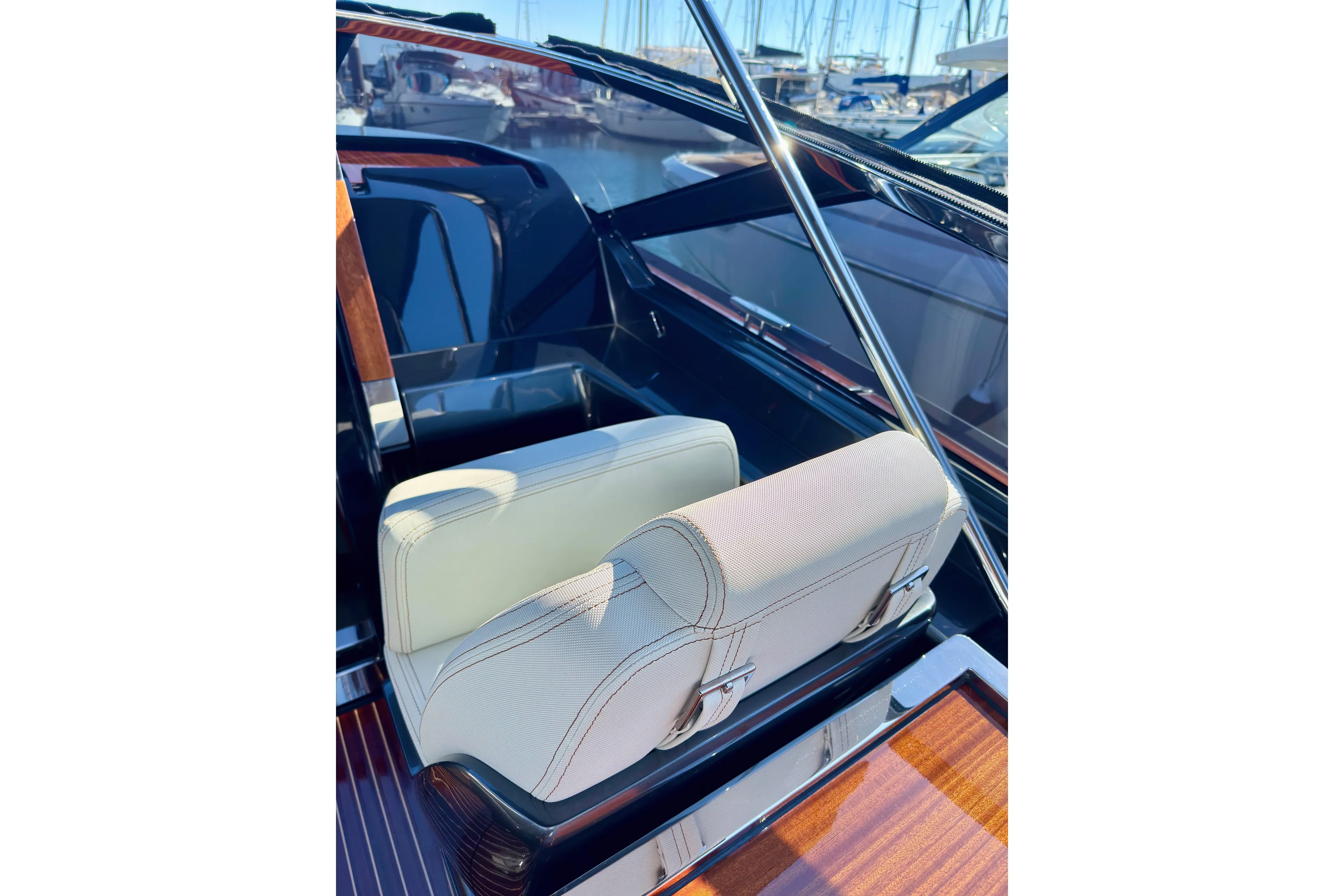  Yacht Photos Pics 2025 Riva Rivamare boat interior with luxurious seating and polished wood accents.