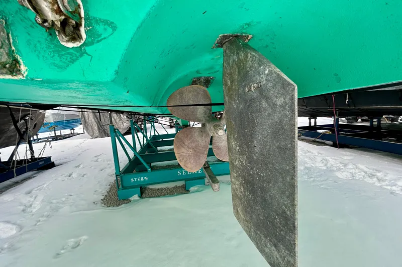  Yacht Photos Pics 2006 Mainship 34 Trawler propeller and rudder on snowy ground.