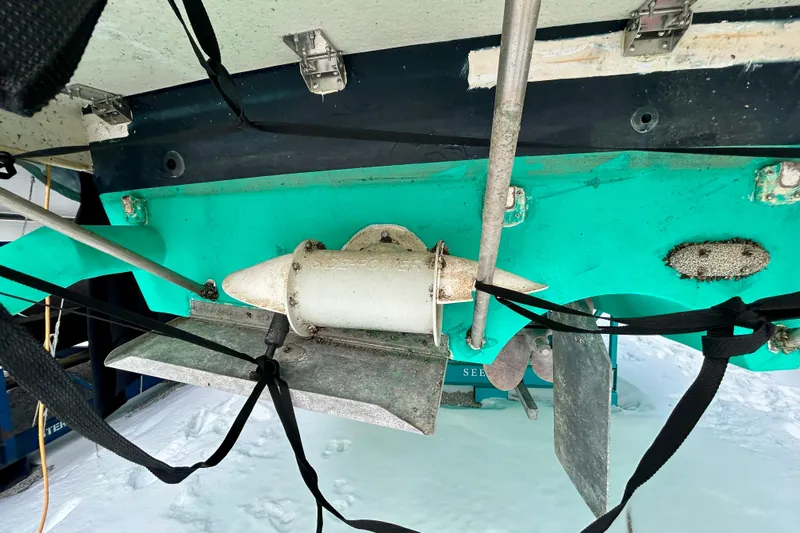  Yacht Photos Pics 2006 Mainship 34 Trawler underside with propeller and rudder details.