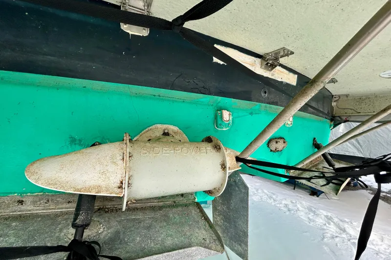  Yacht Photos Pics 2006 Mainship 34 Trawler underside with Side-Power thruster, docked on snowy ground.