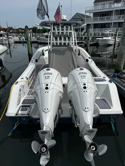  Yacht Photos Pics 2024 Tidewater 280 CC Adventure boat docked with twin 250 HP engines.