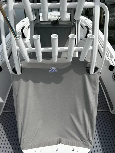  Yacht Photos Pics 2024 Tidewater 280 CC Adventure boat with rod holders and protective cover.