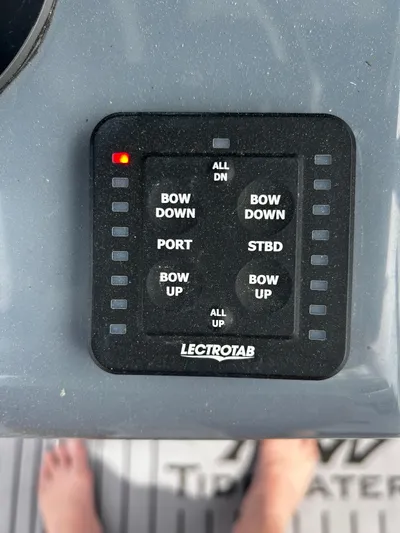  Yacht Photos Pics Control panel on 2024 Tidewater 280 CC Adventure boat with trim tab buttons.