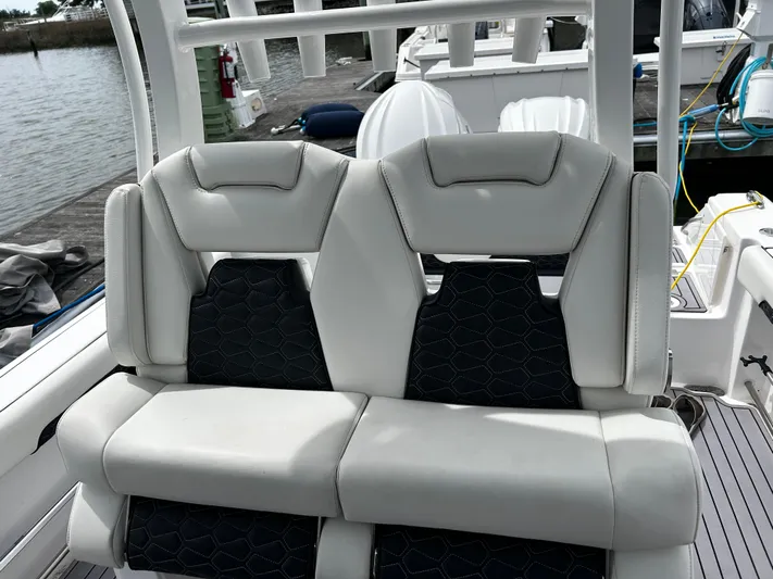  Yacht Photos Pics 2024 Tidewater 280 CC Adventure boat seats with sleek design and comfortable upholstery.