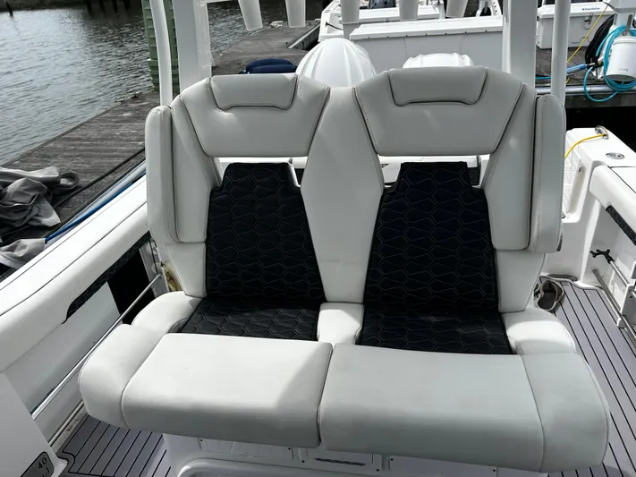  Yacht Photos Pics 2024 Tidewater 280 CC Adventure boat seats with sleek design and comfortable upholstery.