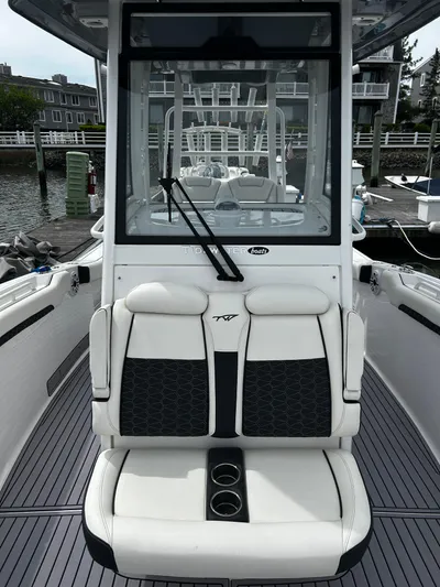  Yacht Photos Pics 2024 Tidewater 280 CC Adventure boat with sleek seating and modern design.