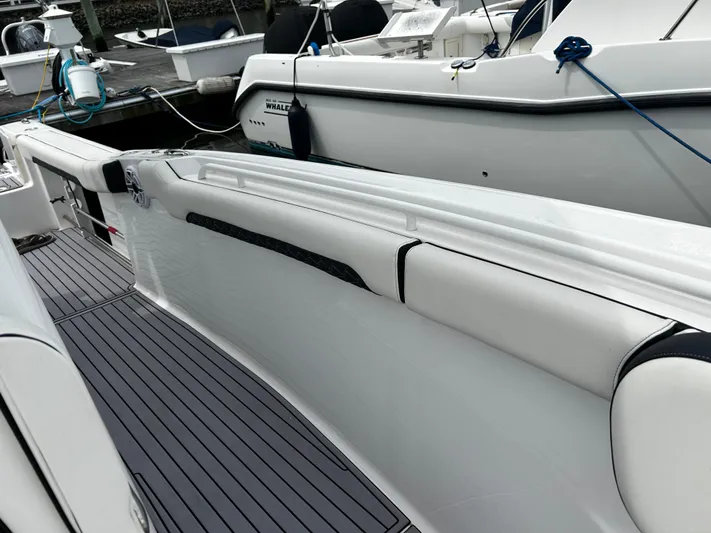  Yacht Photos Pics 2024 Tidewater 280 CC Adventure boat with sleek white interior and modern design.