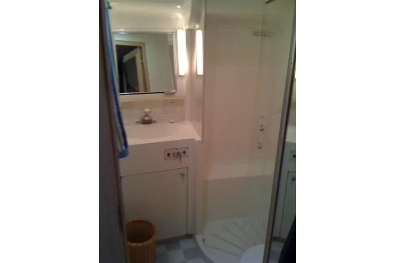  Yacht Photos Pics Bathroom interior of 1995 Hatteras 39 Sport Express yacht, featuring sink and shower.