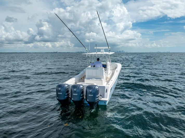  Yacht Photos Pics 2018 Invincible 36 boat with triple outboard engines on open water.