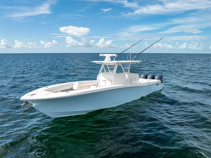  Yacht Photos Pics 2018 Invincible 36 boat on open ocean with clear blue sky.