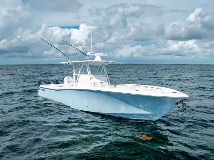  Yacht Photos Pics 2018 Invincible 36 boat on open water with fishing rods.