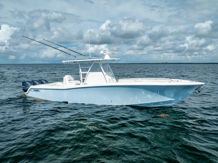  Yacht Photos Pics 2018 Invincible 36 boat on open water under cloudy sky.