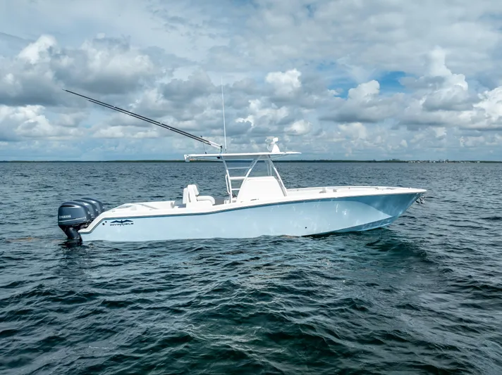  Yacht Photos Pics 2018 Invincible 36 boat on open water under cloudy sky.