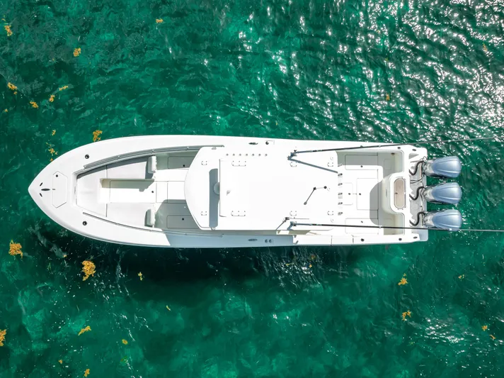  Yacht Photos Pics Aerial view of a 2018 Invincible 36 boat on clear turquoise water.