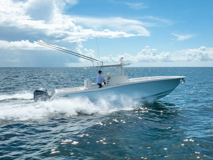  Yacht Photos Pics 2018 Invincible 36 boat cruising on open water under a clear sky.