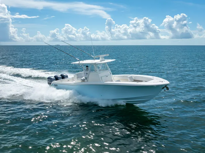  Yacht Photos Pics 2018 Invincible 36 boat cruising on open water under a clear sky.